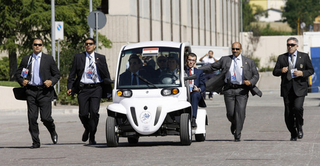 Illustration for article titled G8 Leaders Look Silly Shuttled Around In GEM Electric Cars